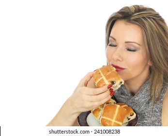 Attractive Young Caucasian Woman, With Brunette Hair, Eating Traditional Easter Celebration Hot Cross Buns, Isolated On White With Copy Space