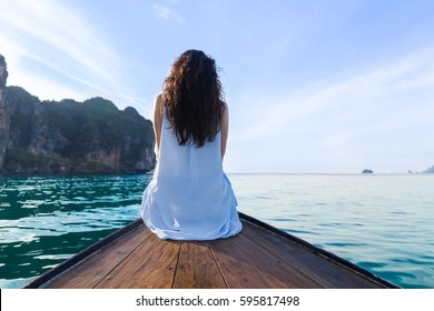 Attractive Young Caucasian Woman Sit On Boat Back Rear View,