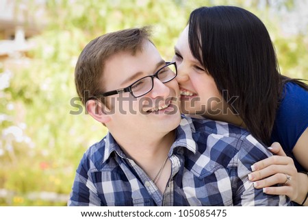 Attractive Young Couple Having Fun Outside in the Park