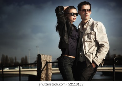 Attractive Young Couple Wearing Sunglasses