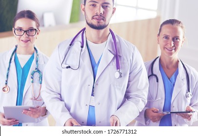 Attractive Young Doctor With His Young Colleagues