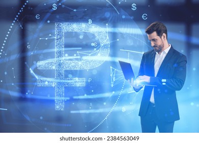 Attractive young european businessman using laptop with glowing digital blue ruble hologram on blurry office interior background. Business finance and money exchange concept. Double exposure - Powered by Shutterstock