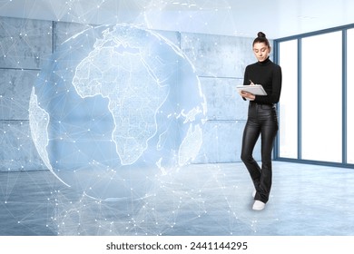 Attractive young european businesswoman with glowing futuristic blue globe hologram writing in blurry empty white office background. Digital innovation and technology concept - Powered by Shutterstock