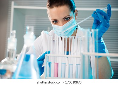 Attractive Young Female Scientist Working In Laboratory