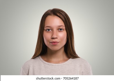 Attractive young girl portrait. Beautiful  female looking at camera. Healthy woman studio portrait. 