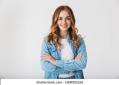 Attractive young girl wearing casual clothes standing isolated over white background, arms folded