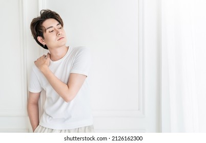 Attractive Young Handsome Smiling Face Positive Asian, Korean Happy Casual Man, Stay Home Minimal Lifestyle. Closeup Portrait Of Asia Middle Age 20s Man Wearing White Shirt In Studio. Young Model Boy 