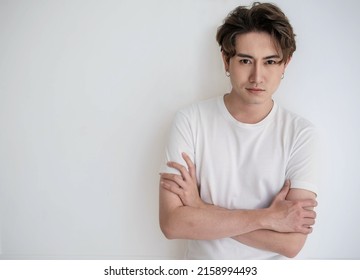 Attractive Young Handsome Smiling Face Positive Asian, Korean Happy Casual Man, Stay Home Minimal Lifestyle. Closeup Portrait Of Asia Middle Age 20s Man Wearing White Shirt In Studio. Young Model Boy