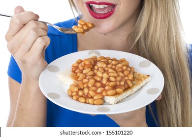 Attractive Young Healthy Fit Woman Eating Tinned Baked Beans And Tomato Sauce On Toast