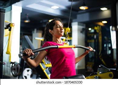 Attractive Young Indian Asian Woman Working Out In The Gym - Health And Fitness Concept