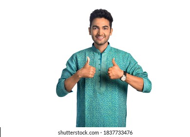 Attractive Young Indian Man Showing Thumbs Up Sign, Isolated on White and Wearing a Kurta