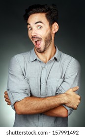 Attractive Young Man Exited And Amazing Looking At Camera And Making Face