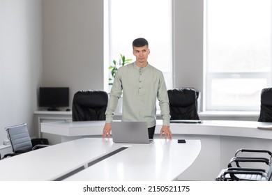 Attractive Young Man In The Office In A Conference Room Alone