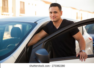 Attractive Young Man Standing Next To His Car And About To Get In