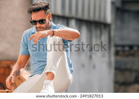 Similar – Image, Stock Photo Handsome young man with stylish haircut. Portrait of teen boy with youth hairstyle is standing on grey background.