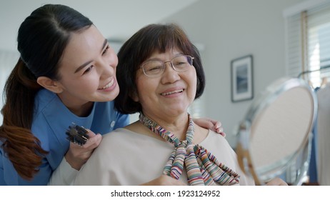 Attractive Young Senior Asian Female Citizen Happy Face With Nurse At Home In Morning In Routine Lifestyle, Hair Brush Combing, Asia Nursing In-home Care Volunteer, Assisted Living Service Concept.