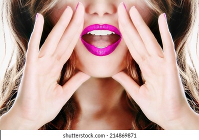 Attractive young sexy woman with pink lipstick lipgloss lips is announcing, telling a secret, shouting or yelling 