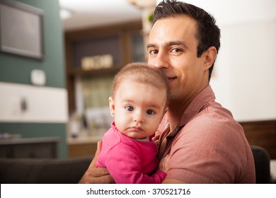 Attractive Young Single Dad Spending Some Time With His Baby Girl At Home