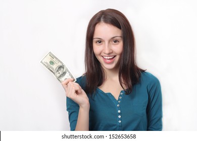 Attractive young smiling woman is holding up a $100.00 bill - Shutterstock ID 152653658