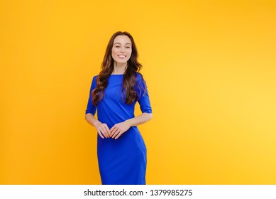 Attractive young smiling woman isolated over yellow background - Shutterstock ID 1379985275
