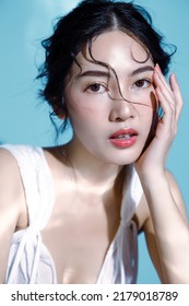 Attractive Young Wet Hair Asian Woman Model With Perfect Fresh Skin On Underwater Simulation Of Lighting Face Care Facial Treatment Cosmetology Plastic Surgery Lovely Girl Portrait In Studio