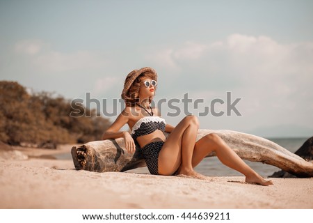 attractive young woman in bikini on the beach