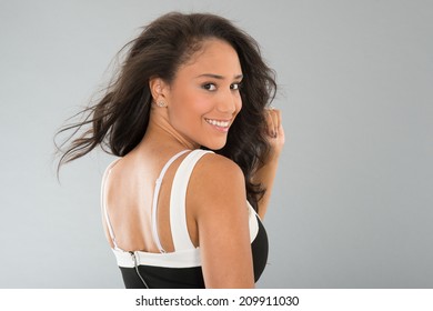 Attractive Young Woman In Black And White Dress Looking Back