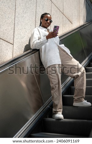 Similar – Attractive black man listening to music with earphones