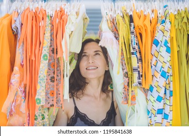 Attractive Young Woman Dreamily Looks At Things In The Store - Shopping And Shopaholic, Consumerism, Sales, Too Much Choice, Temptation And Dream Big Concepts