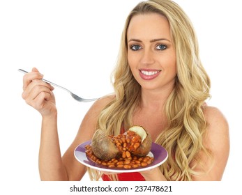 Attractive Young Woman Eating A Baked Potato With Beans