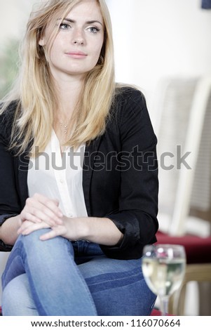 Similar – Happy girl using a smart phone sitting on a couch at home