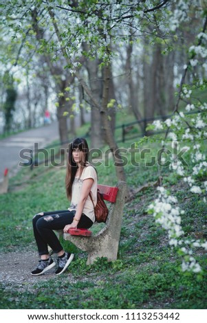 Similar – Beautiful young woman smiling and walking happy on the park outdoors