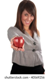 An Attractive Young Woman Hold A Red Apple, Isolated On White, With Room For Your Text. Focus On Her Hand And Apple For A Forced Perspective