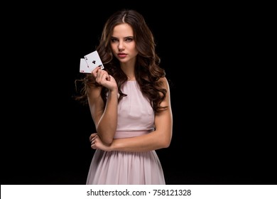 Attractive Young Woman Holding The Winning Combination Of Poker Cards