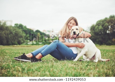 Similar – Foto Bild Glücklicher lächelnder Hund mit seinem hübschen jungen Besitzer