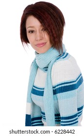 Attractive young woman modeling a blue winter sweater and scarf.