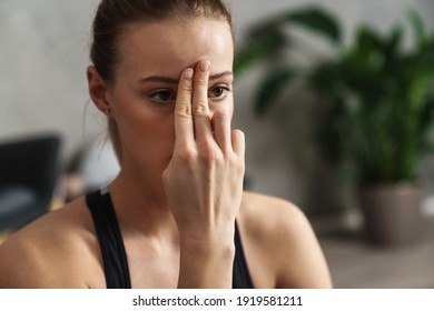 Attractive Young Woman Practicing Yogic Breathing Technique In Studio, Close Up