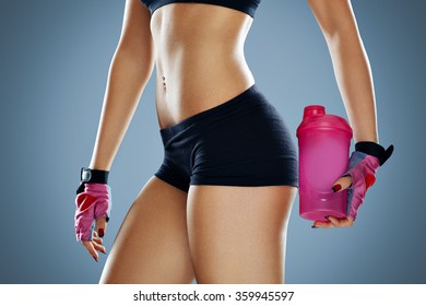 Attractive Young Woman With Protein Shake Bottle