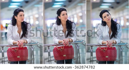 Attractive young woman with red bag in shopping center. Beautiful fashionable young lady with long hair in white male shirt in mall. Casual long hair brunette posing smiling and teasing, indoors shot