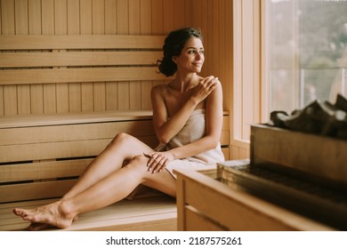 Attractive young woman relaxing in the sauna - Powered by Shutterstock