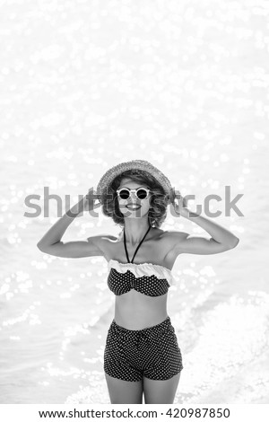 attractive young woman in swimsuit on the beach