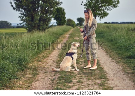 Similar – Image, Stock Photo Loving young woman offered a paw by her dog