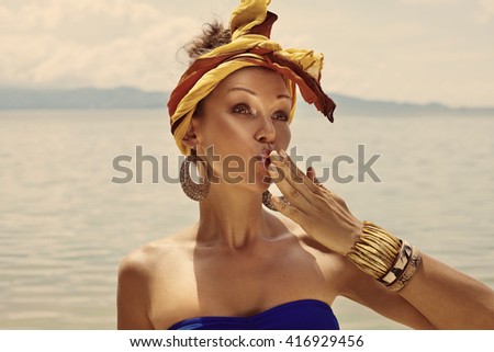 attractive young woman in turban outdoors