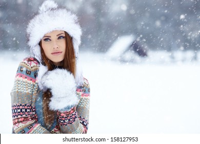 Attractive young woman in wintertime outdoor 