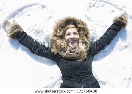 An Attractive young woman in wintertime outdoor