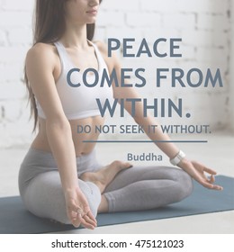 Attractive young woman working out in loft interior, doing yoga exercise on blue mat, meditating, closeup. Motivational phrase "Peace comes from within. Do not seek it without". Buddha