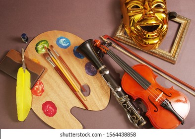 Attributes Of The Arts. Music, Painting, Literature, Theater. Violin, Art Palette And Brushes, Fountain Pen, Notebook, Theater Mask.