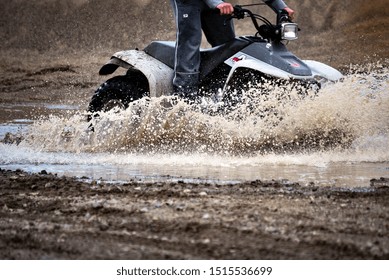 ATV Driving Fast Through Deep And Muddy Water