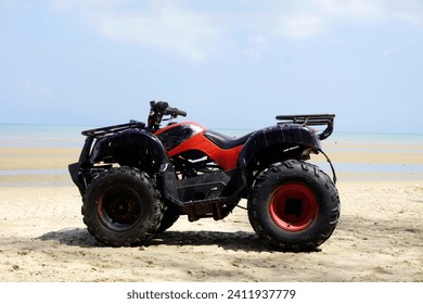 ATV motorbike parked on the beach. Vehicles rented by beach visitors, these vehicles are used for tourists' enjoyment. - Powered by Shutterstock