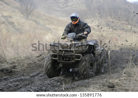 atv racing on dirt track at spring